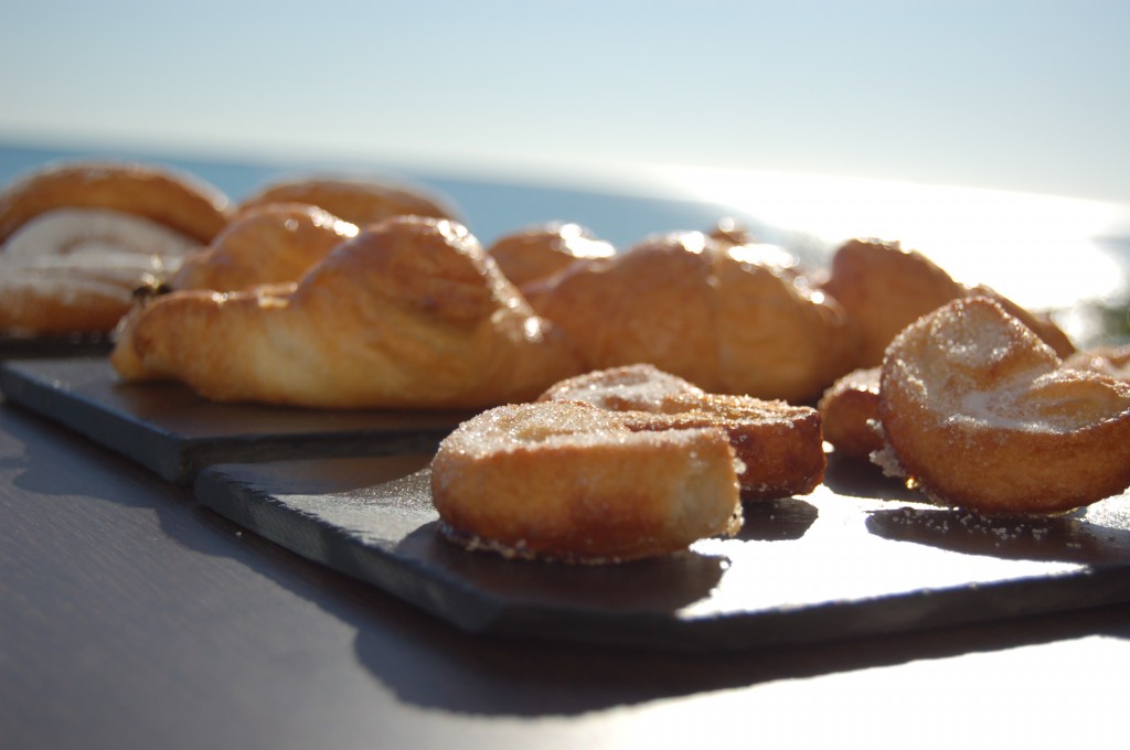 Small croissants waiting by the sea to be eaten!